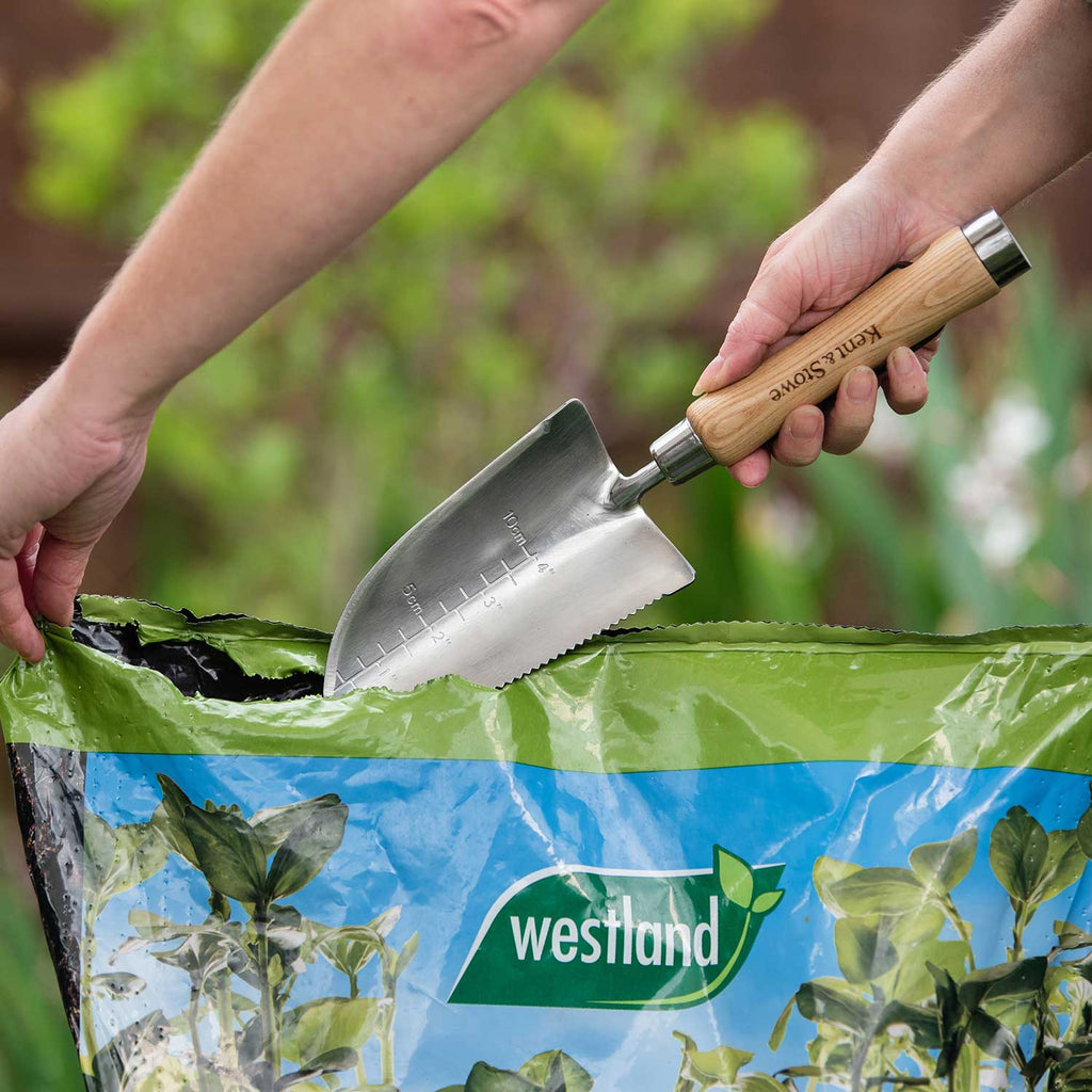 Cazzuola da giardinaggio in acciaio inossidabile con bordo seghettato e scala di profondità