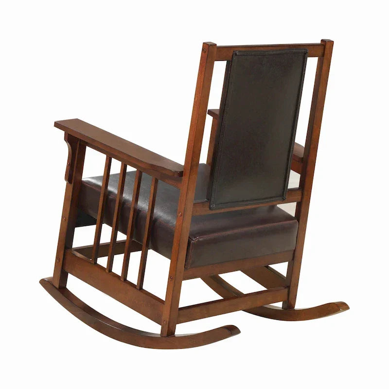 Mecedora estilo misionero, asiento y respaldo tapizados en cuero, tabaco y marrón oscuro