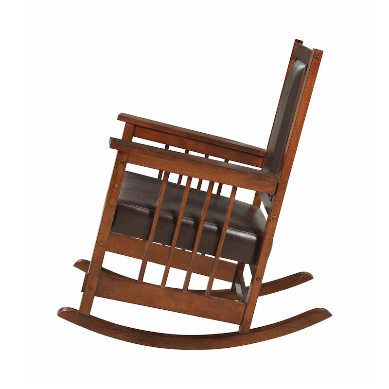 Mecedora estilo misionero, asiento y respaldo tapizados en cuero, tabaco y marrón oscuro