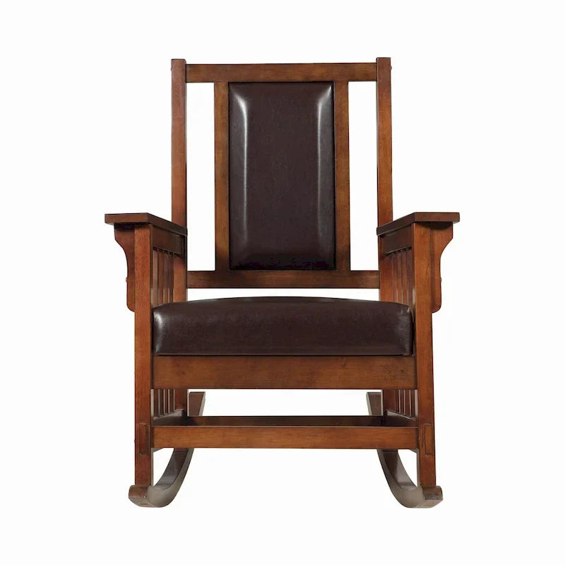 Mecedora estilo misionero, asiento y respaldo tapizados en cuero, tabaco y marrón oscuro